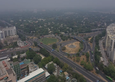 An aerial shot of the AIIMS flyover with running traffic in New Delhi, India