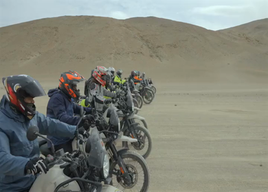 A Shot of Adventure Bikers Group in Cold Desert Landscape of Ladakh India
