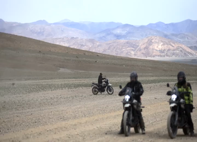 A Shot of Adventure Bikers Group in Cold Desert Landscape of Ladakh India