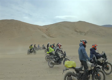 A Shot of Adventure Bikers Group in Cold Desert Landscape of Ladakh India