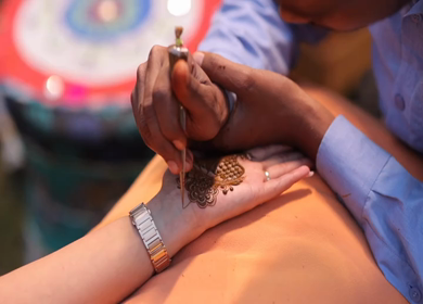 A Slow Motion Shot of Applying Mehndi on Bride's hand at her Indian Wedding in India