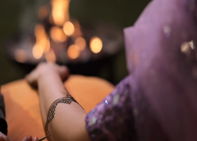 A Slow Motion Shot of Applying Mehndi on Bride's hand at her Indian Wedding in India