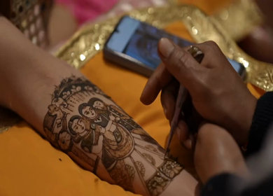 A Slow Motion Shot of Applying Mehndi on Bride's hand at her Indian Wedding in India