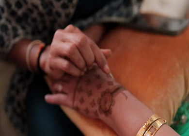 A Slow Motion Shot of Applying Mehndi on Bride's hand at her Indian Wedding in India