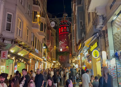 4th June 2026 : A Shot of Crowded Night Street Leading to Galata Tower in Istanbul Turkey