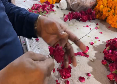 02nd April 2026 : A Shot of Flower Vendor Making Garlands at Market in Delhi India