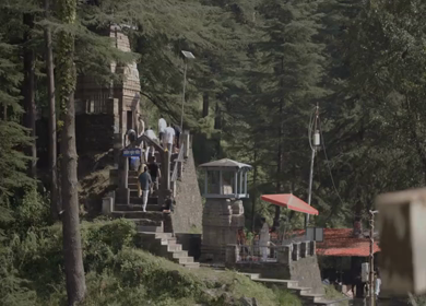 A Shot of Jageshwar Temple Stone Shrine and Visitors Among Deodar Forests, Almora