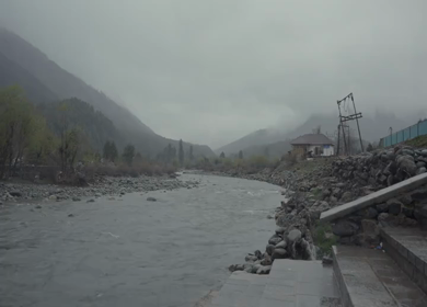 A Shot of Pahalgam Lidder River and Misty Himalayan Mountains Jammu and Kashmir India