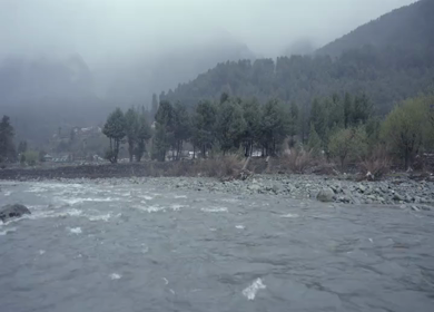 A Shot of Pahalgam Lidder River and Misty Himalayan Mountains Jammu and Kashmir India