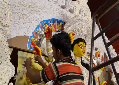 28th September 2025 : A Shot of Workers Decorating Durga Puja Pandal with Idols in India