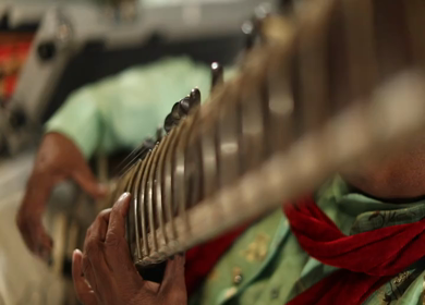 A Slow Motion Shot of a man Playing Sitar at an Indian Wedding in New Delhi,India
