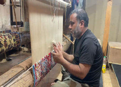 3rd October 2022: A Shot of a man working at a Silk Cloth Factory in Kashmir,India 