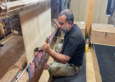 3rd October 2022: A Shot of a man working at a Silk Cloth Factory in Kashmir,India 