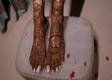 A Shot of Indian Bride showing Mehndi at her Indian Wedding in New Delhi,India
