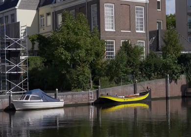 A Slow Motion Shot of Boat and Bridge from boat in Canal Amsterdam