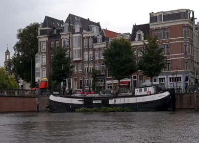 20th March 2026 : A Slow Motion Shot of Boat and Bridge from boat in Canal Amsterdam