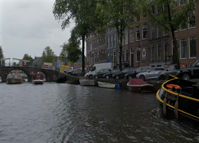 20th March 2026 : A Slow Motion Shot of Boat and Bridge from boat in Canal Amsterdam
