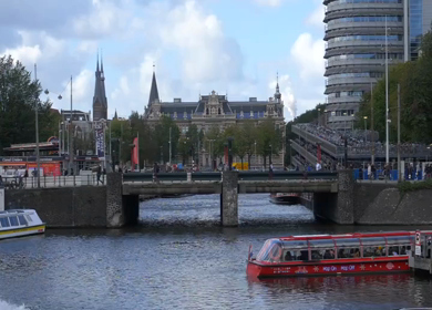 20th March 2026 : A Slow Motion Shot of Boat and Bridge from boat in Canal Amsterdam