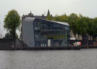 A Slow Motion Shot of Boat and Bridge from boat in Canal Amsterdam