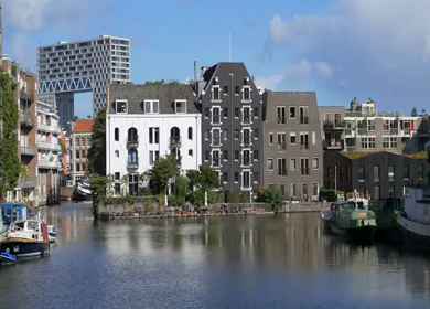 A Slow Motion Shot of Boat and Bridge from boat in Canal Amsterdam