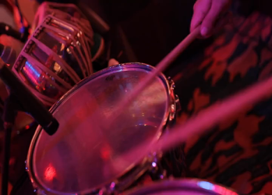 A shot of a musician playing drums instrument at an Indian Wedding function in India