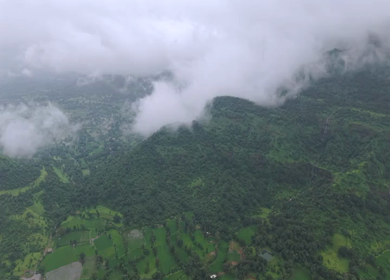 Aerial Drone View of Bhandardara Landscape with Green Valley River and Monsoon Clouds Maharashtra India