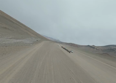 Aerial FPV View of Bikers Riding Through the Scenic Mountains of Ladakh, India