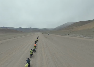 Aerial FPV View of Bikers Riding Through the Scenic Mountains of Ladakh, India
