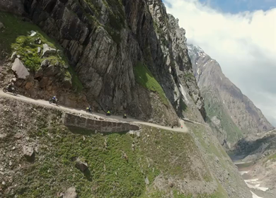 Aerial FPV View of Bikers Riding Through the Scenic Mountains of Ladakh, India