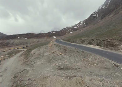 Aerial FPV View of Bikers Riding Through the Scenic Mountains of Ladakh, India