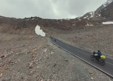 Aerial FPV View of Bikers Riding Through the Scenic Mountains of Ladakh, India