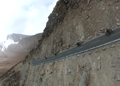 Aerial FPV View of Bikers Riding Through the Scenic Mountains of Ladakh, India