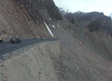 Aerial FPV View of Bikers Riding Through the Scenic Mountains of Ladakh, India