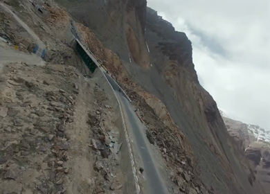 Aerial FPV View of Bikers Riding Through the Scenic Mountains of Ladakh, India