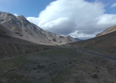 Aerial FPV View of Bikers Riding Through the Scenic Mountains of Ladakh, India