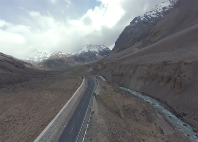 Aerial FPV View of Himalayan Road and Snow-Capped Mountains in Ladakh, India