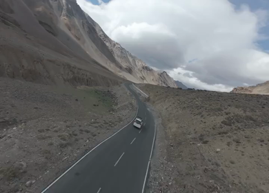Aerial FPV View of Himalayan Road and Snow-Capped Mountains in Ladakh, India