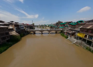 Aerial FPV shot of Zaina Kadal Bridge over the Jhelum River in Srinagar, Kashmir