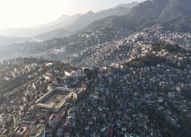 Aerial Hyperlapse of Kohima City Stadium and Hillside Urban Landscape in Nagaland India