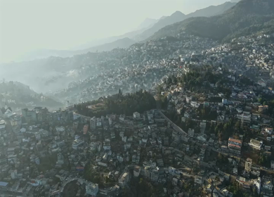 Aerial Hyperlapse of Kohima Cityscape with Hills and Morning Mist in Nagaland India