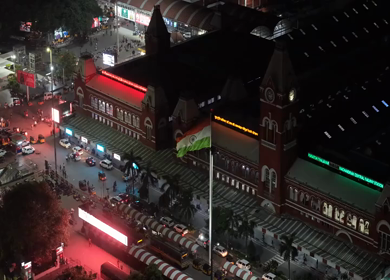 Aerial Night Slow motion View of Chennai Central Railway Station and City Traffic