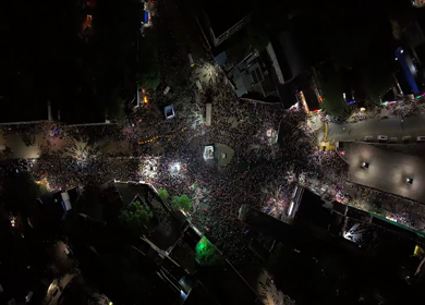Aerial Night View of Azhagar Festival Crowd Near Vaigai River in Madurai Tamil Nadu India