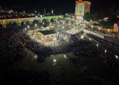 Aerial Night View of Azhagar Festival Crowd Near Vaigai River in Madurai Tamil Nadu India