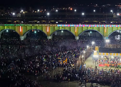 Aerial Night View of Azhagar Festival Crowd Near Vaigai River in Madurai Tamil Nadu India
