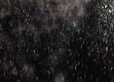 Aerial Night View of Azhagar Festival Crowd Near Vaigai River in Madurai Tamil Nadu India