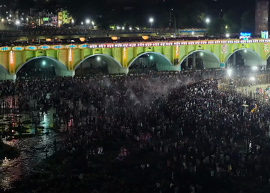 Aerial Night View of Azhagar Festival Crowd Near Vaigai River in Madurai Tamil Nadu India