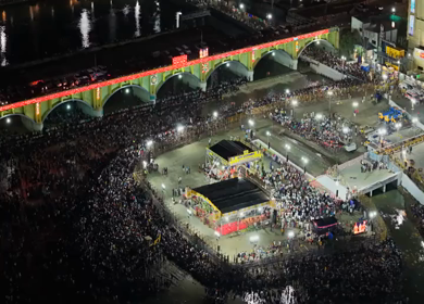 12th May 2025 : Aerial Night View of Azhagar Festival Crowd Near Vaigai River in Madurai Tamil Nadu India