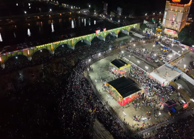 12th May 2025 : Aerial Night View of Azhagar Festival Crowd Near Vaigai River in Madurai Tamil Nadu India