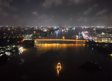 Aerial Night View of Howrah Bridge and Ferry River Kolkata, India