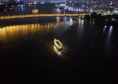 Aerial Night View of Howrah Bridge and Ferry River Kolkata, India